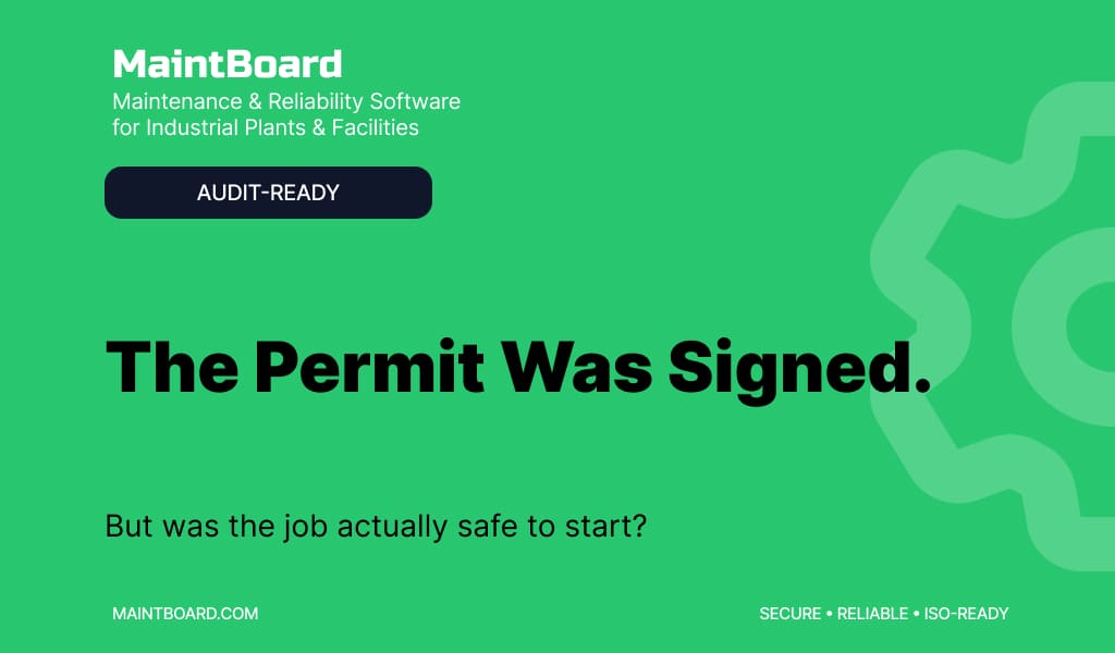 Maintenance supervisor and safety officer reviewing a Permit to Work before technicians begin maintenance inside a factory
