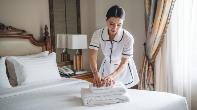 Hotel maintenance staff reviewing building operations using MaintBoard CMMS